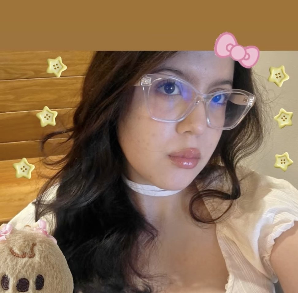 Portrait with glasses, a pink bow and star stickers